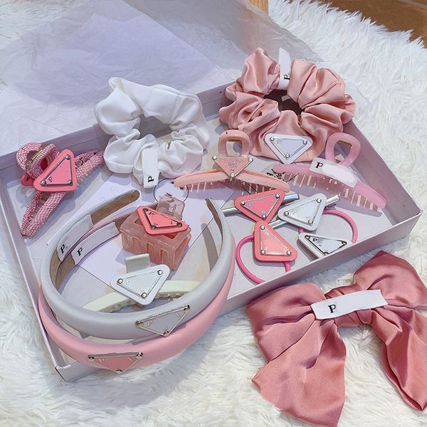 Stylish designer women's headbands with inverted triangle and letter P design, featuring elastic bands and fashionable bows