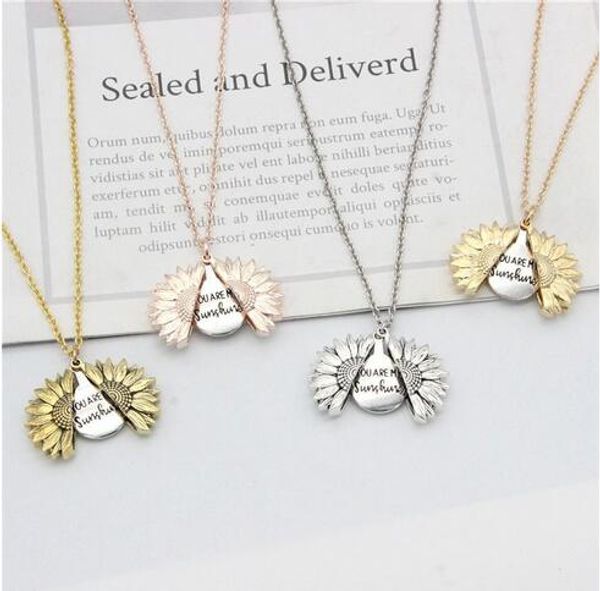 Sunflower locket necklace with engraved "You are My Sunshine" message, a golden Valentine's gift for women that can be opened