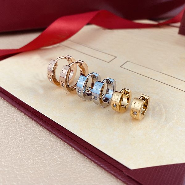 Titanium steel 18K gold dangle earrings, elegant designer jewelry for women with a simple yet fashionable love-inspired design