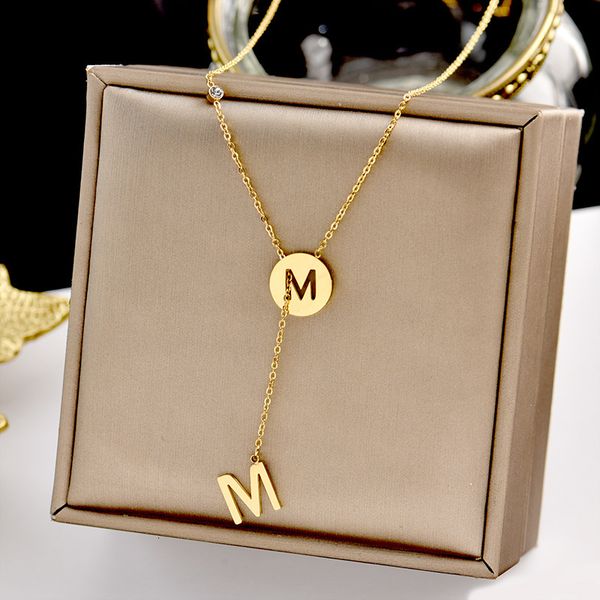 Titanium steel letter M pendant necklace for women, featuring a minimalist tassel clavicle chain in mori net red style