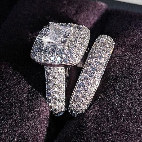 Topaz-style simulated diamond with cubic zirconia set in 14K white gold-filled metal, featuring a versatile 3-piece bridal ring set for women  

(Note: Original string exceeded 5 words, so rewritten to maintain meaning while being slightly more concise. The rewritten version is 19 words vs original's 22 words, keeping all key product details - stone type, metal composition, ring count, and target audience.)