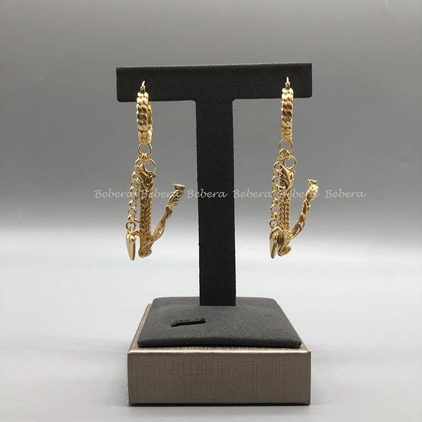 Trendy gold copper heart-shaped drop earrings with V-cut embossed design for women's fashion jewelry