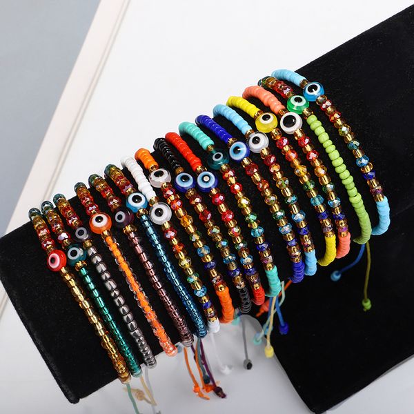 Turkish-inspired white and blue evil eye couple bracelets for women, featuring colorful beads and woven rope chain design