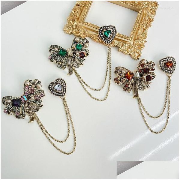 Vintage Baroque pearl bow brooch with double chain fringe for stylish coat and suit accessories