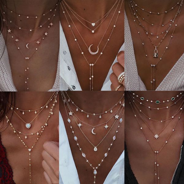 Vintage crystal pendant necklace featuring geometric star and moon charms, a boho-style multi-layered choker jewelry piece for women