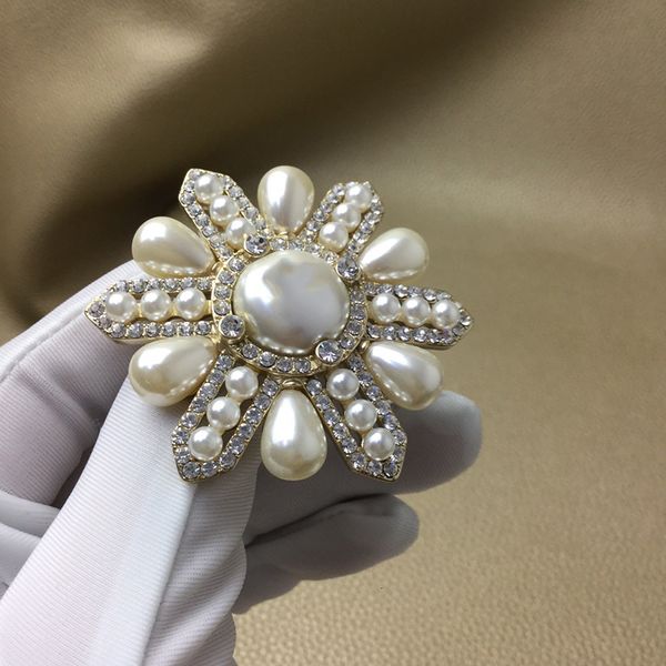 Vintage Egyptian Pharaoh-inspired sunflower brooch with pearls for stylish sweater embellishment