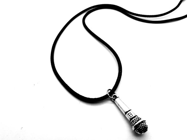 Vintage KTV wireless mic pendant necklace for hip hop DJs and rappers, featuring a music-themed charm on a leather cord