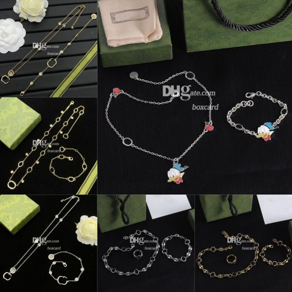 Vintage-inspired 18K gold-plated necklace and bracelet set with letter pendant, featuring a stylish chain design and presented in a branded gift box