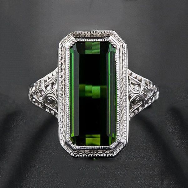 Vintage-inspired carved green stone ring with geometric silver detailing for men and women, perfect as an engagement or statement jewelry piece