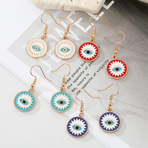 Vintage-style enamel evil eye dangle earrings for women, featuring Turkish blue eye pendants, perfect for punk statements and wedding parties