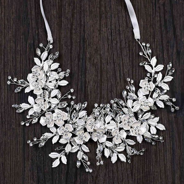 Wedding hair accessories featuring a white leaf headband for brides, perfect for a princess-style dress