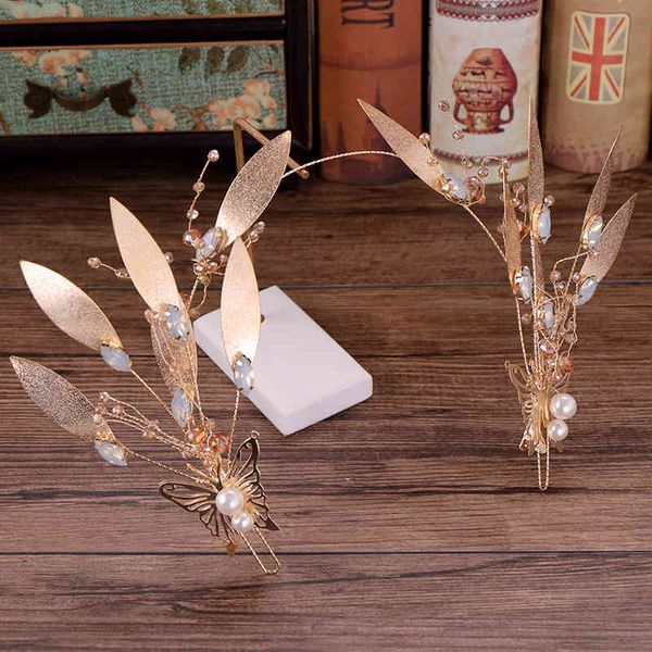 Wedding hair accessories featuring baroque gold leaf hoop headpieces for elegant bridal styling