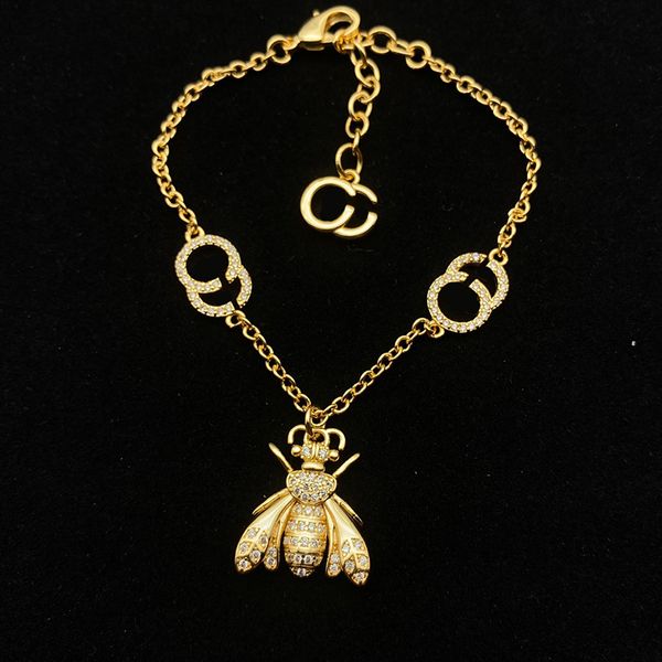 Women's Bee Jewelry Set featuring a gold pendant necklace, matching bracelet, and elegant earrings with luxury diamond accents, perfect for parties