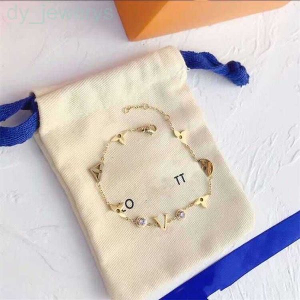 Women's designer bracelet featuring a gold-plated chain with trendy floral lock pendant and diamond charms, exuding luxury and love