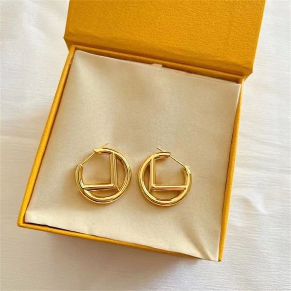 Womens designer gold hoop earrings featuring premium letter designs for stylish jewelry lovers