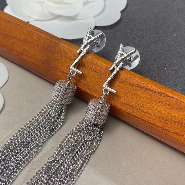 Women's elegant long pendant earrings in gold or silver, featuring macrame designs and letter Y studs, perfect for weddings and parties, presented in a gift box