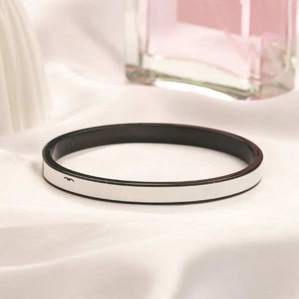 Women's stylish gold curb bracelet with black leather accents, unisex vintage-inspired jewelry gift in stainless steel