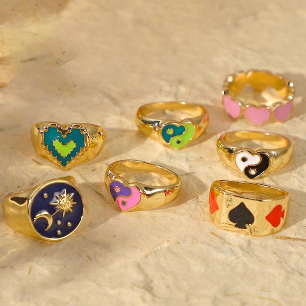 Y2K gold-plated cluster rings featuring moon, sun, heart, and yin yang designs for women, embodying vintage punk fashion with 90s aesthetic poker charms